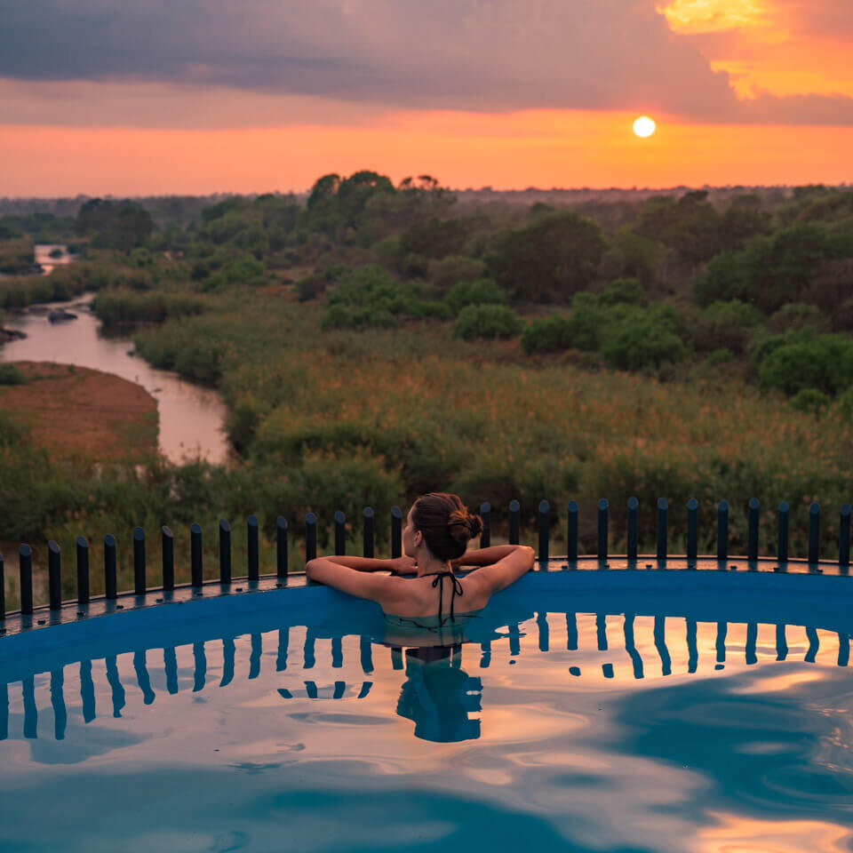 sunrise from the pool, overlooking the African savanna in the Kruger Shalati, Train on the Bridge Hotel in South Africa